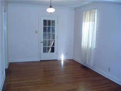 The dining room is adjacent to the living room and