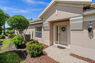 Elegant front entryway with lush greenery
