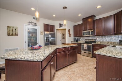 The kitchen is huge and features granite counterto