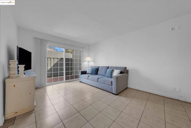 Living room featuring light tile patterned floors