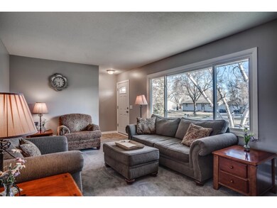 The welcoming front foyer opens effortlessly to th