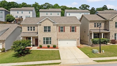 View of front of house with brick siding, concrete