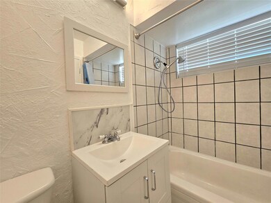 Full bathroom with vanity, toilet, and shower / ba