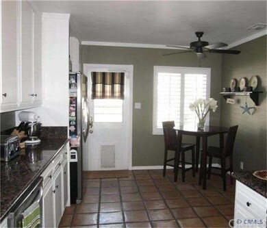 Kitchen offers paver floors and cozy breakfast noo