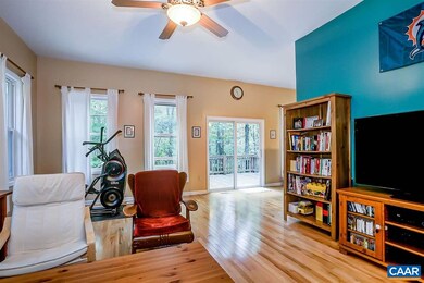Large family room addition with ceiling fan & adja