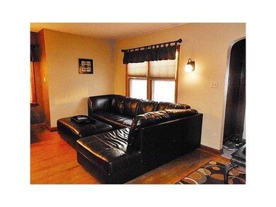 Family Room-L1. Original arched doorways and hardw