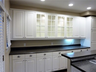 Wall of Cabinets with a Pantry. Great Serving Area