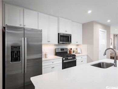 Kitchen with appliances with stainless steel finis