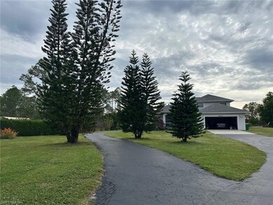 Paved driveway leading to the back of home.