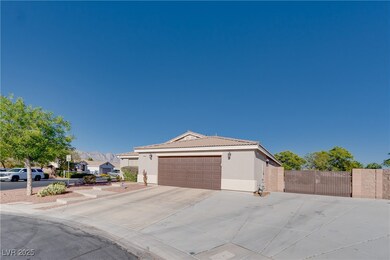 View of front of house with stucco siding, a gate,