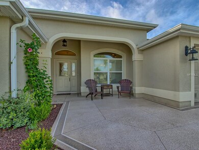 PAINTED DRIVEWAY/WALKWAY leads up to the COVERED F