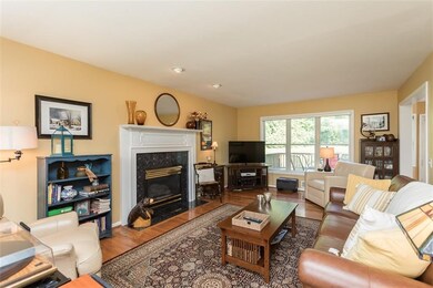 Fireplaced family room is open to 2-story foyer an