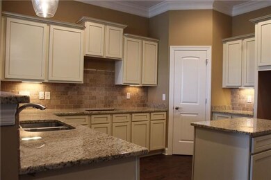 Stock photo showing this U shaped kitchen with working island