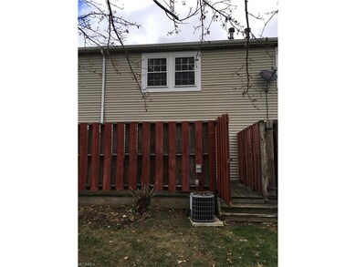 Back of townhouse with new roof and private deck -
