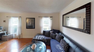 ANOTHER VIEW OF LIVING ROOM.