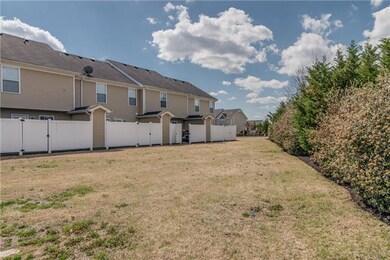 Wow ~ very nice green space with TREE LINE---- PRIVACY --- and you will NOT be looking at other neighbors on their patios!!!   This is hard to find and such a unique feature about this sweet townhome!!!    