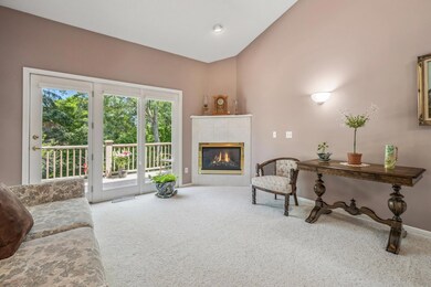 Lots of natural sunshine and opens up to your maintenance-free deck that overlooks mature trees.