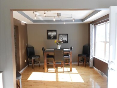 LIGHT AND BRIGHT DINING ROOM WITH UPDATED HARDWOOD