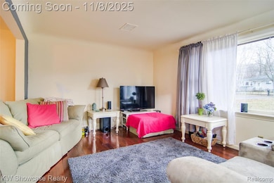 Living area featuring dark wood finished floors