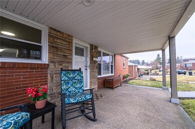 Perfect porch to sit and relax with beautiful ston