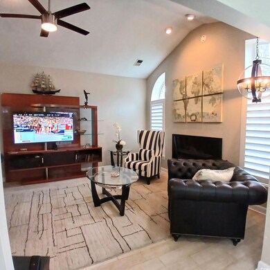 Living room featuring vaulted ceiling and ceiling 
