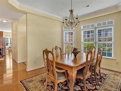 Dining Room with tray ceiling and bay windows.