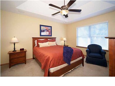 Master bedroom has tray ceilings and an extra clos