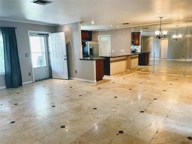 Living room towards Kitchen and front door