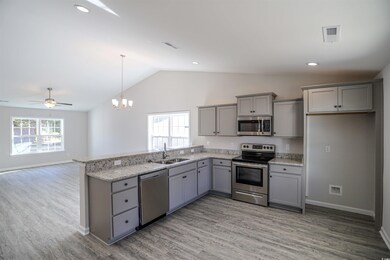 Kitchen featuring plenty of natural light, applian