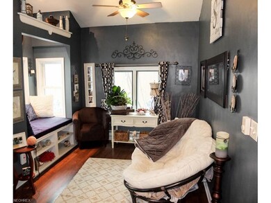 Family room/sun room with vaulted ceiling and a wi