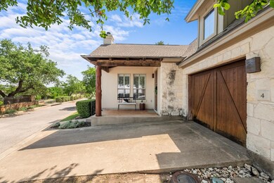 View of exterior entry featuring stone siding, a 
