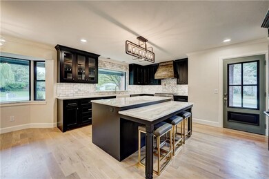 Kitchen with marble countertops, eating space, bre