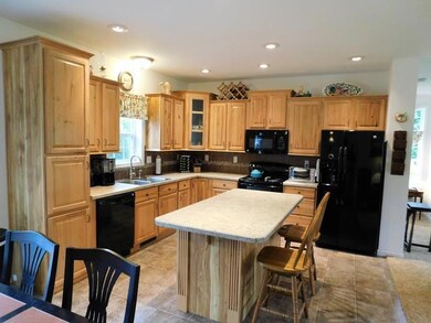 Eat In Kitchen With Island & Hardwood Cabinets