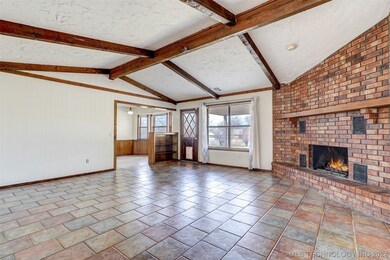 Large Open Family room with brick wall fireplace w