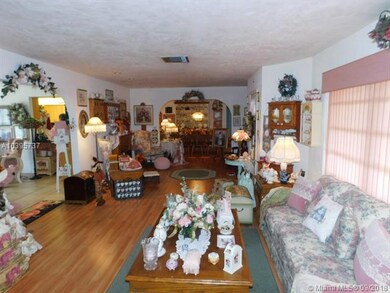 LIVING ROOM VIEW INTO DINING and family/kitchen