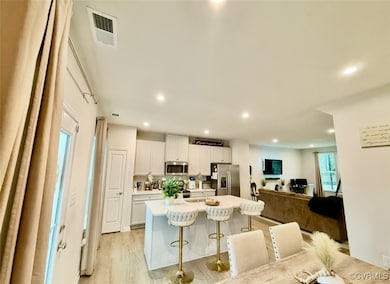 Dining area featuring light wood-type flooring and