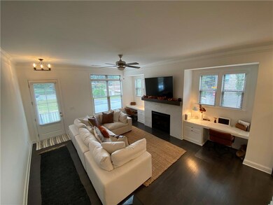 Living area featuring a fireplace with flush heart