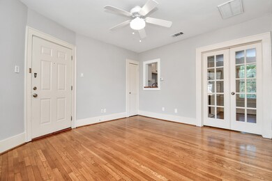 Living room with french doors that lead into offic