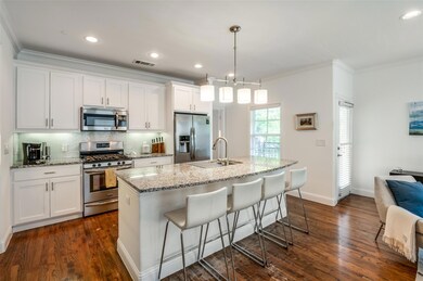 Another view of the pretty kitchen. Door to the ri