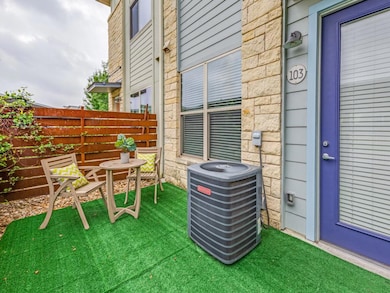 View of patio featuring fence and central AC unit