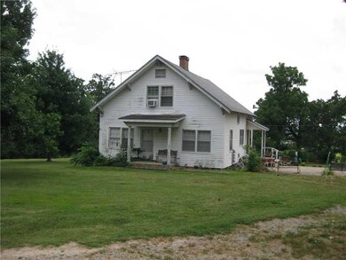 Exterior Front. Solid 2-story 4BR 3BA farmhouse sits on top of the hill overlooking west Fayetteville.