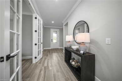 Decorative Glass impact front door and welcoming entry foyer is the perfect space to greet guests.