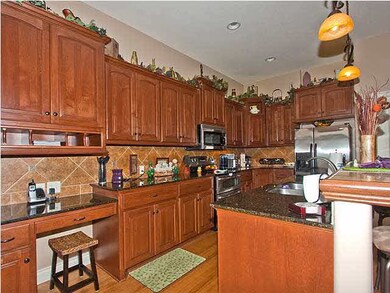 built in desk, microwave & center island w/ eating