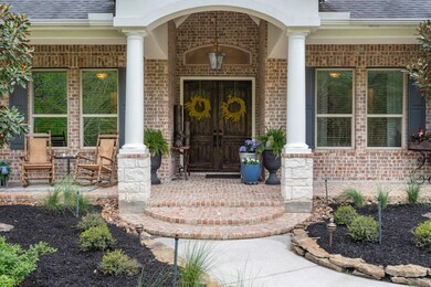 Welcoming entry as as you step up onto the expansive, brick-paved covered front porch!