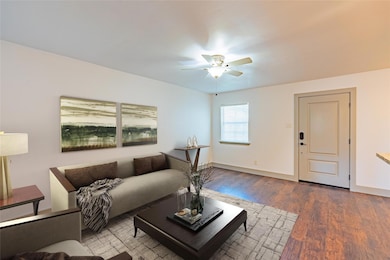 Living room featuring wood-type flooring and ceili