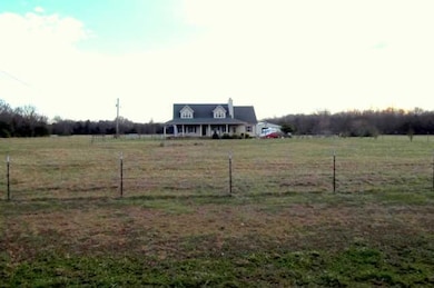 Serenity and privacy abound. Home is situated well off of the road. Lots of room to ride horses. A large round pen will remain with property.