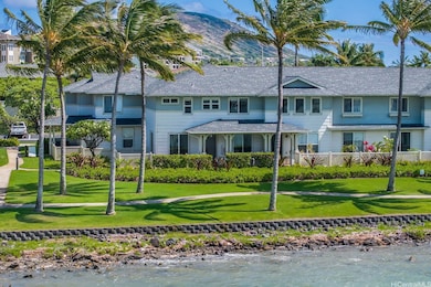 This waterfront corner unit is surrounded by lovel