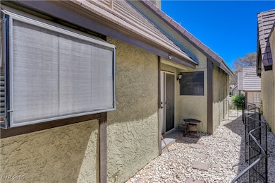 View of home's exterior featuring stucco siding an