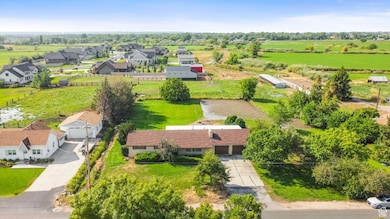 Overview of rural landscape featuring nearby suburban area