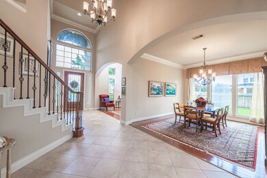 Tile floors greet you as you enter and usher you past the study and formal dining room towards the open family room and kitchen area.